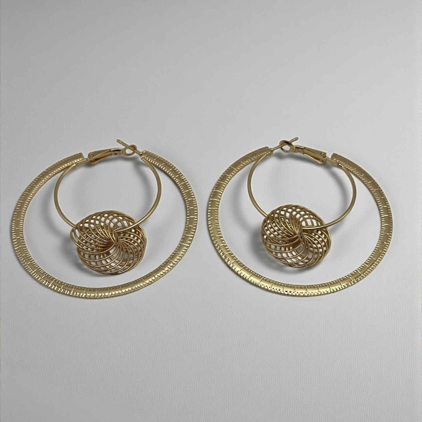 Modern Spiral Geometric Hoop Earrings – Gold & Silver Statement Design - Fatisha Boutique #