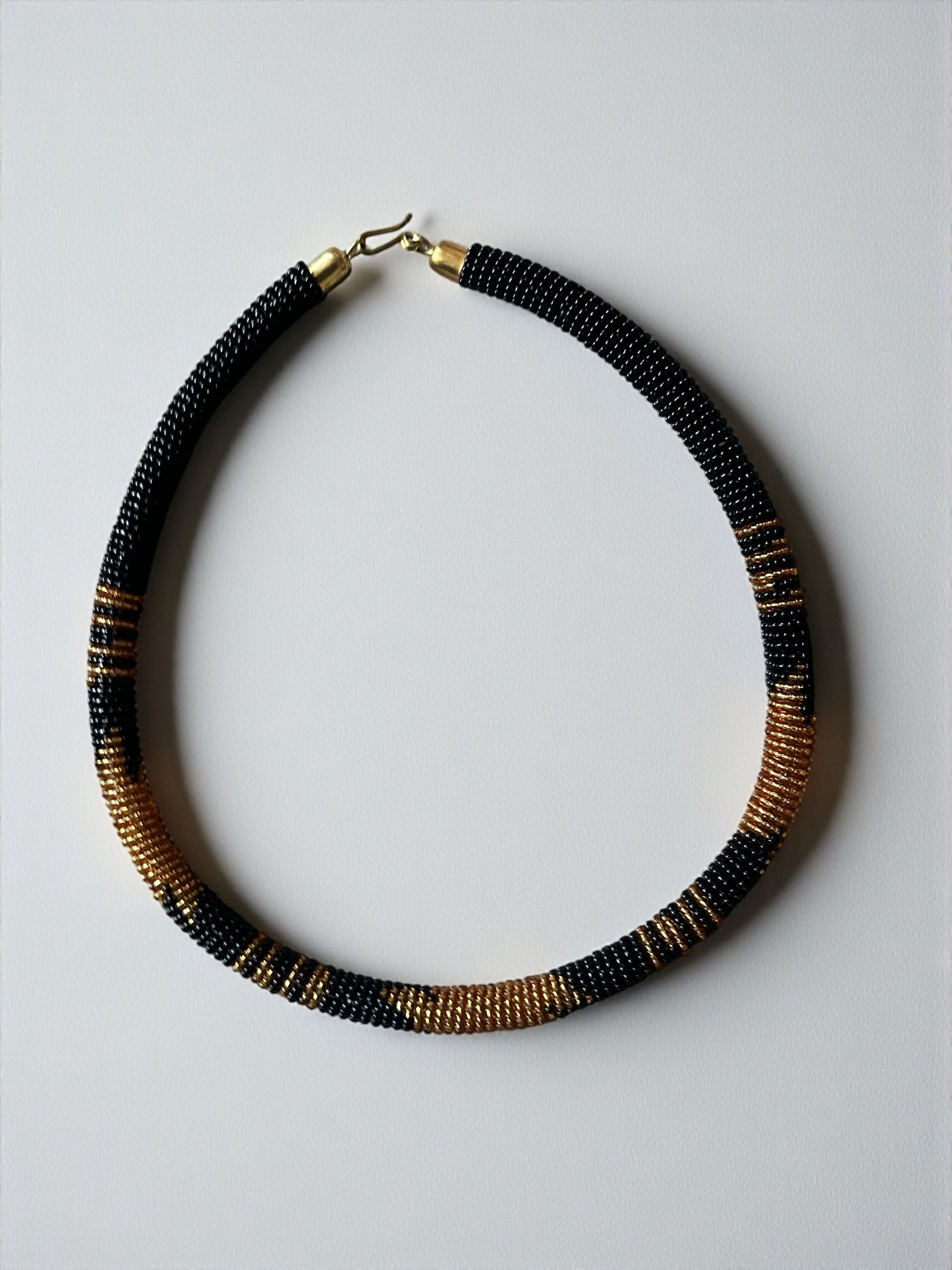 Handmade African Zulu Necklace – Black & Gold Beaded Tribal Jewellery - Fatisha Boutique #