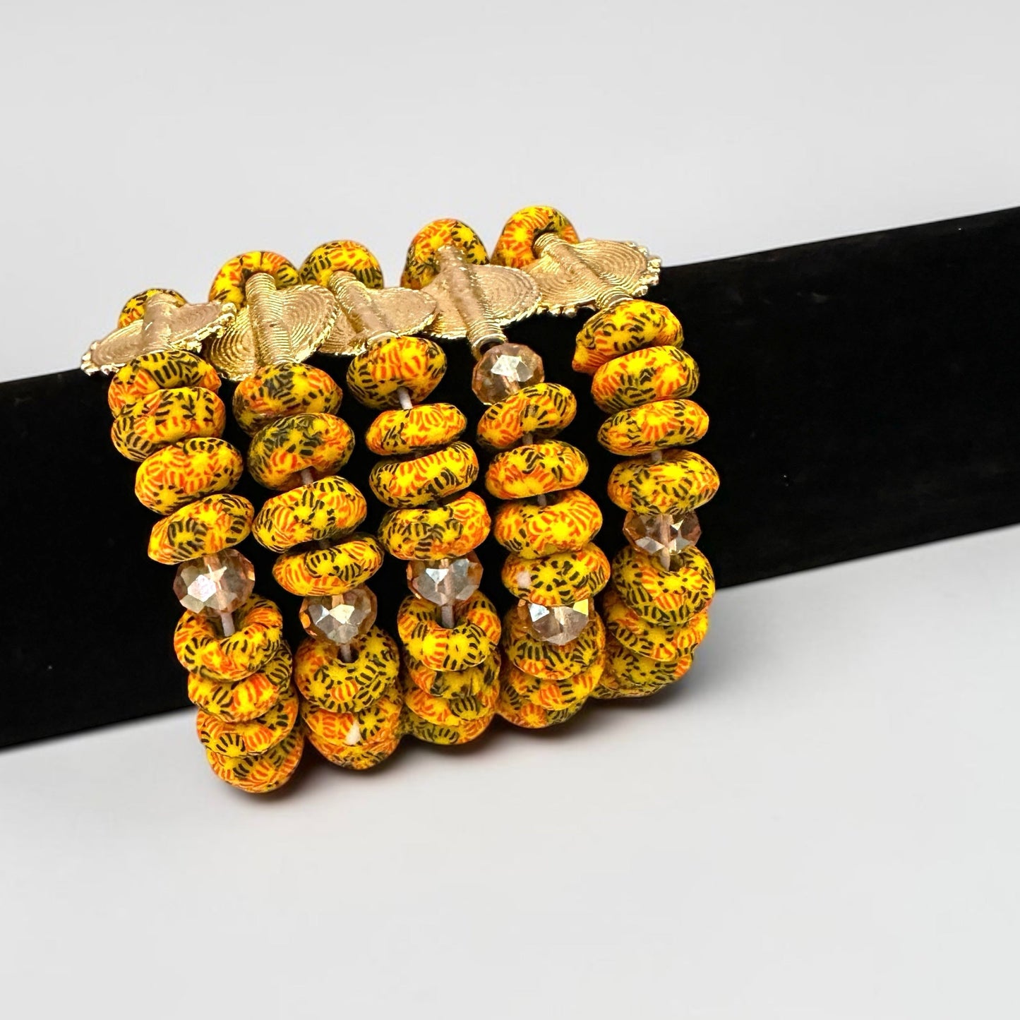Krobo Bead Stretch Bracelet – Ghana Glass with Brass Sun Charm - Fatisha Boutique Fatisha Boutique