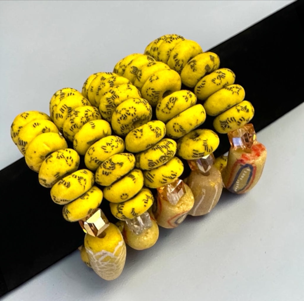 Krobo Bead Stretch Bracelet – Ghana Glass, Yellow with Painted Focal Bead - Fatisha Boutique