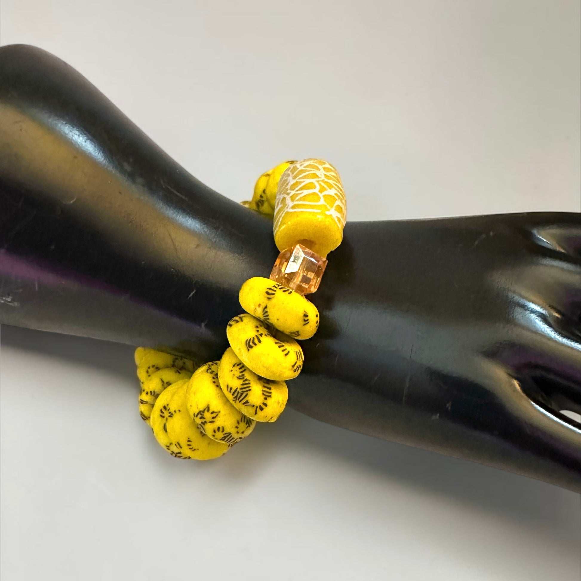 Krobo Bead Stretch Bracelet – Ghana Glass, Yellow with Painted Focal Bead - Fatisha Boutique