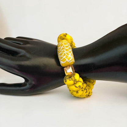 Krobo Bead Stretch Bracelet – Ghana Glass, Yellow with Painted Focal Bead - Fatisha Boutique
