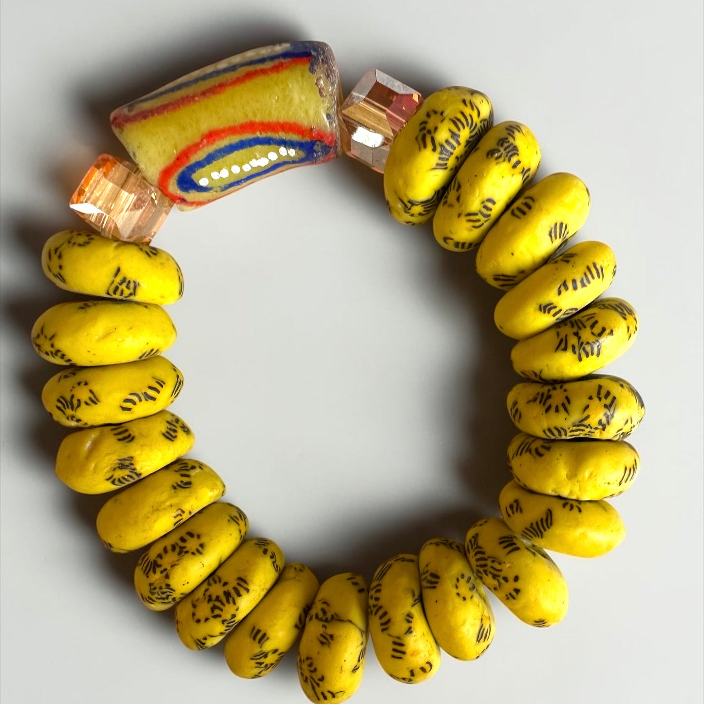 Krobo Bead Stretch Bracelet – Ghana Glass, Yellow with Painted Focal Bead - Fatisha Boutique Fatisha Boutique