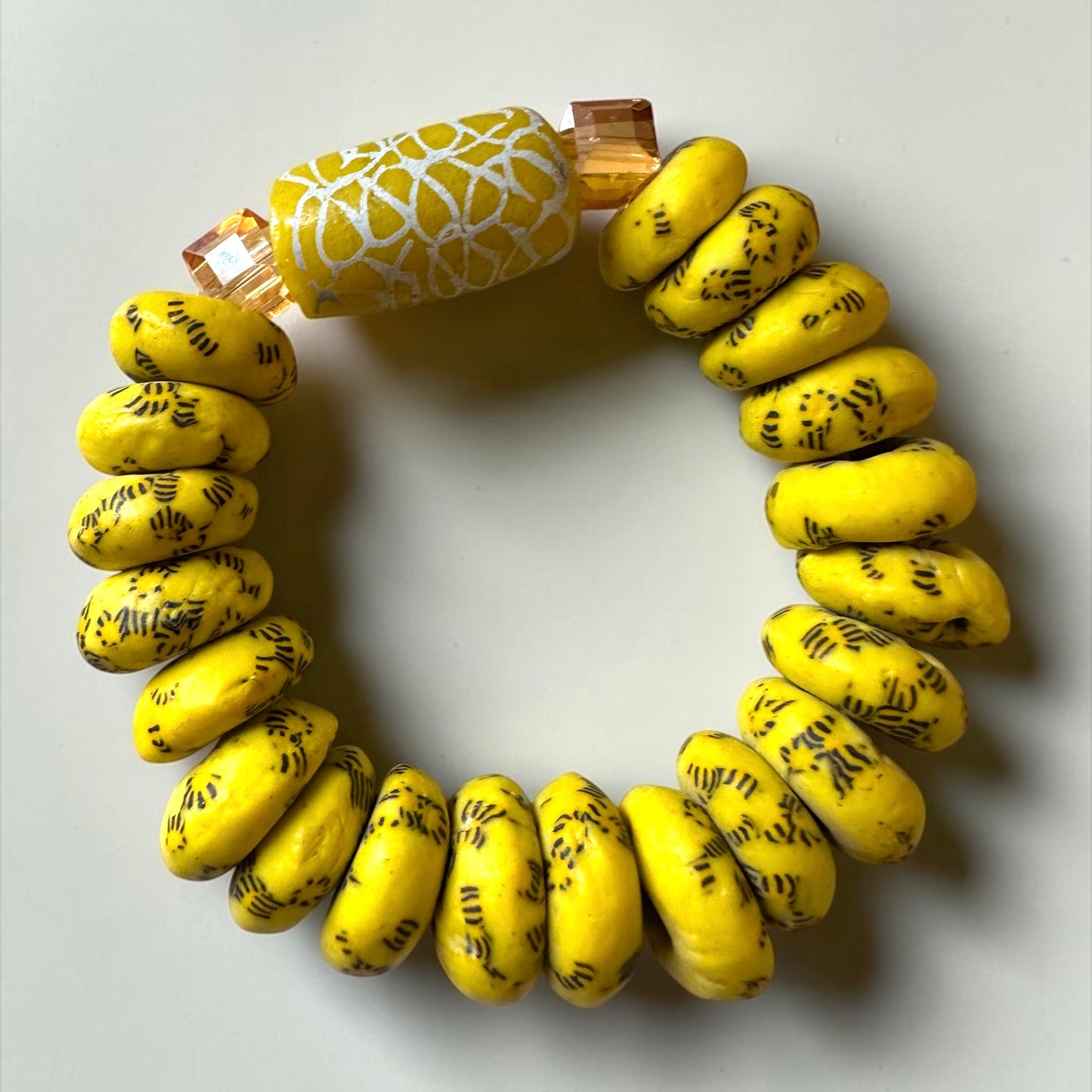 Krobo Bead Stretch Bracelet – Ghana Glass, Yellow with Painted Focal Bead - Fatisha Boutique Fatisha Boutique