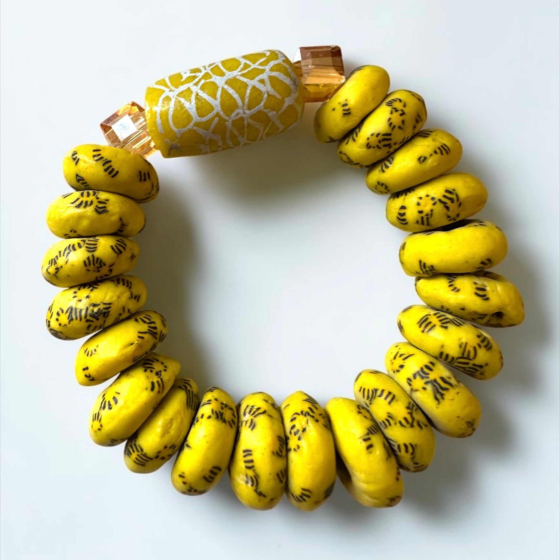 Krobo Bead Stretch Bracelet – Ghana Glass, Yellow with Painted Focal Bead - Fatisha Boutique