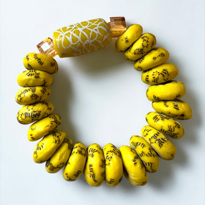Krobo Bead Stretch Bracelet – Ghana Glass, Yellow with Painted Focal Bead - Fatisha Boutique
