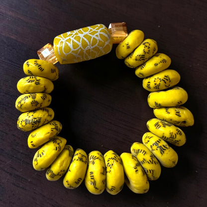 Krobo Bead Stretch Bracelet – Ghana Glass, Yellow with Painted Focal Bead - Fatisha Boutique