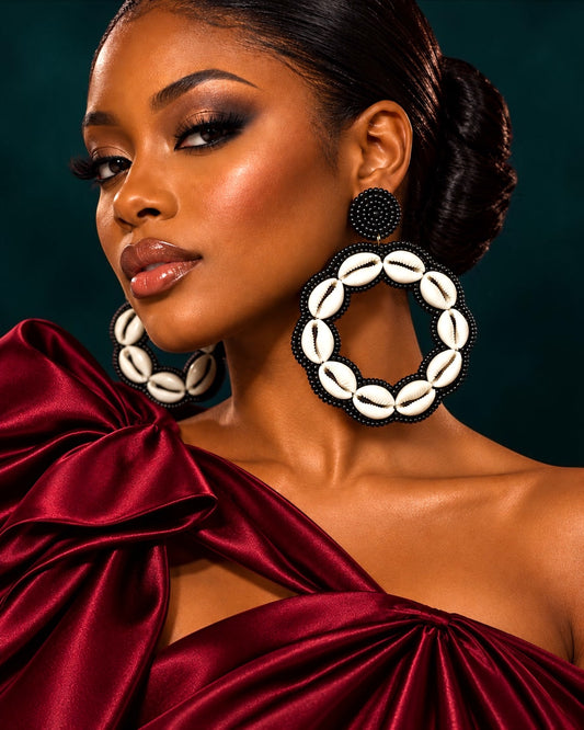 Black handmade cowrie shell hoop earrings with natural ivory shells and black glass seed beads