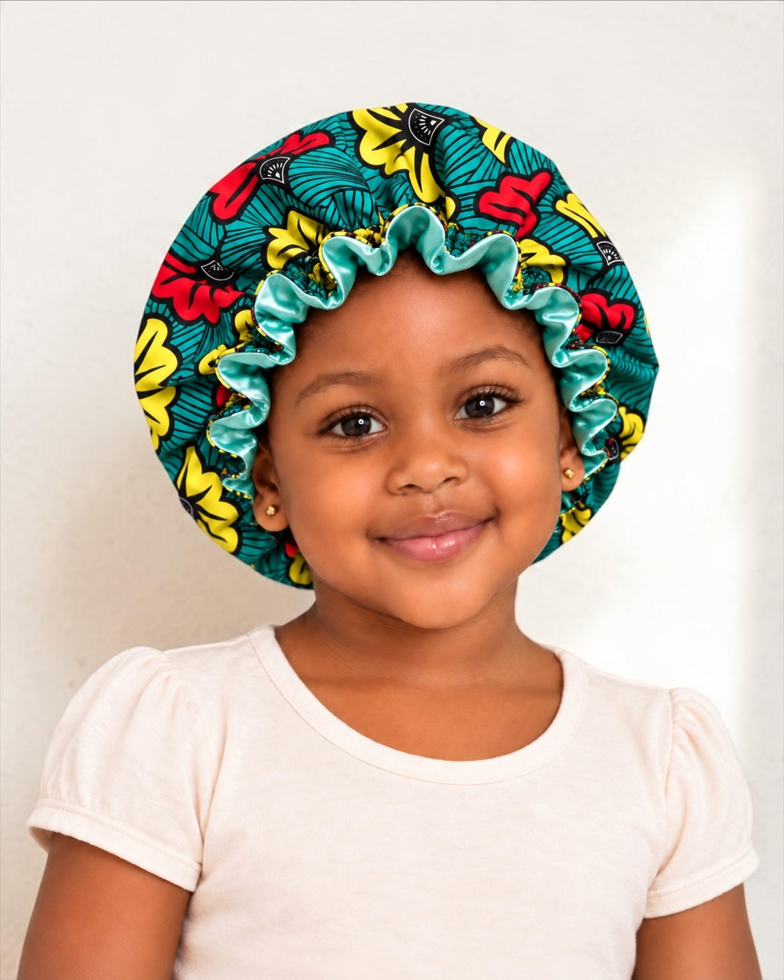Kids Reversible Ankara Satin Silk Ruffle Bonnet – Ages 1–5 - Fatisha Boutique Fatisha Boutique